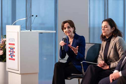 Two panellists on the podium at the Brussels conference representing the European Commission and university alliances